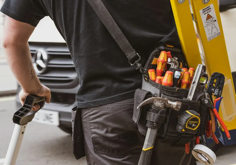 Technician servicing an AC unit